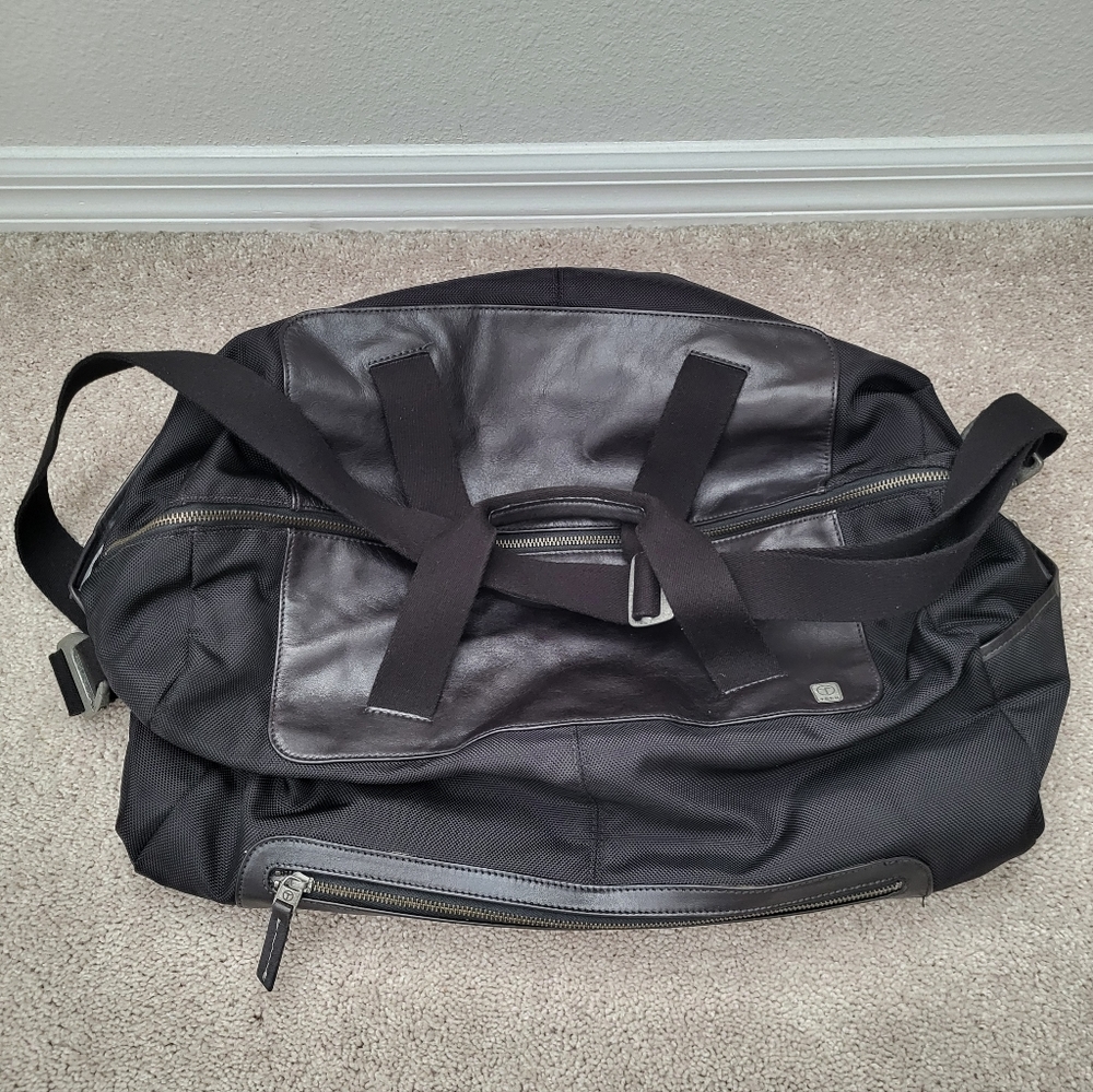 TUMI Duffle Bag Tech black leather Accents metal buckles